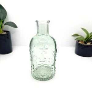 Embossed Light Green Glass Decorative Bottle With Fleur-De-Lis Pattern & Rounded